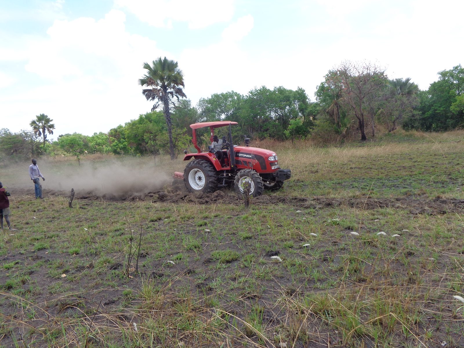 A tractor ploughing a member field